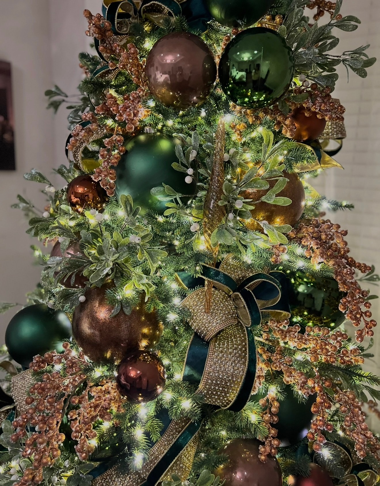 Traditional Christmas tree with large gold north stars — second angle