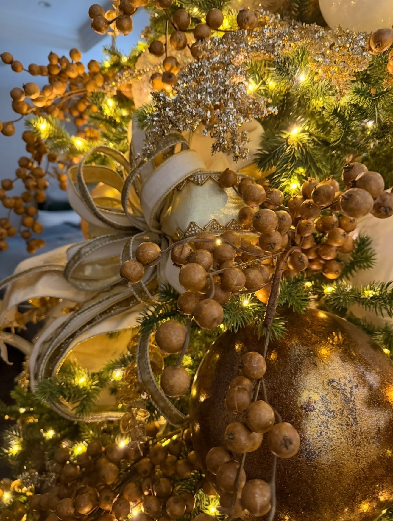 Elegant gold and champagne Christmas tree — golden berry ornament detail